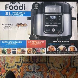 Brand new XL pressure cooker and AirFryer all in 1! New brand .